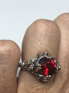 Unusual deep toned red synthetic tourmaline Sterling Filigree Setting Handmade set with genuine pink, white and blue tiny sapphires Size 6.5 Can be resized by laser for $10 -$20 fee All rings are shipped in a nice gift box. Check out our over a THOUSAND great reviews Engraving is $4 per letter and is not always perfect depending on the piece. It can take a few days if the jeweler is busy. This is payable to Paypal Judithsltd@gmail.com Collectible Ruby Ring With Accent Stones, Opal Bangle, Gothic Ring, Red Tourmaline, Silver Gift Wrap, Gothic Rings, Red Band, Silver Gifts, Multi Stone Ring