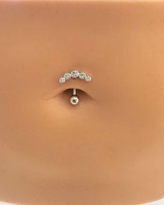 a fake nose ring with three stones on it