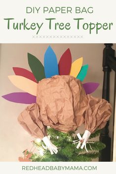 a turkey paper bag sitting on top of a christmas tree with the words diy paper bag turkey tree topper