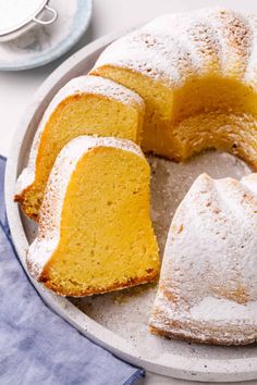 A close-up of a moist Kentucky butter Bundt cake dusted with powdered sugar, sliced to reveal its rich, golden interior. Butter Bundt Cake Recipes, Moist Vanilla Bundt Cake, Butter Bundt Cake, Vanilla Bundt Cake, Easy Peach Pie, Sopapilla Cheesecake Bars, Bundt Cake Recipes, Kentucky Butter Cake