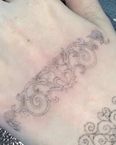 a person with a tattoo on their foot