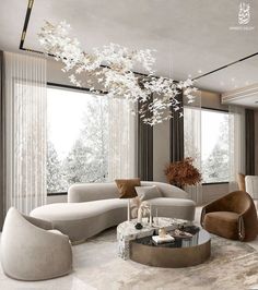 an elegant living room with modern furniture and chandelier