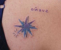 a woman's tattoo with the word sueno written on her upper back