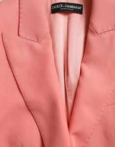 Designed with front flap pockets, long sleeves with buttoned cuffs, and luxurious logo details. Color: Pink Button Closure Lapels Flap Pockets Buttoned cuffs Material: 57% Polyester, 35% Viscose, 8% Elastane Lining: 92% Silk, 8% Elastane Button Closure Made in Italy Blazer Rose, Luxurious Logo, Lapel Blazer, Italian Craftsmanship, Sneaker Jewelry, Peak Lapel, Chic Pink, Pink Blazer, Dolce E Gabbana