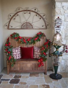 a wooden bench sitting next to a christmas decoration