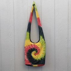 "high quality Tie Dye Shoulder or Crossbody Bag 100% cotton inside too.. machine washable and Dry. Cotton Large vibrant lightweight bright colored sunburst tie dye 100% cotton bag measuring 14\" wide by 13\" long with a 4\" wide gusseted bottom 13\" zippered opening; inside zippered pocket; fully lined; roomy for all your essentials including books, tablet or use as a overnight or diaper bag 2.5\" wide strap distributes weight for comfortable shoulder or cross body wear; strap length is 23\" and Casual Multicolor Cotton Bags, Casual Multicolor Cotton Canvas Bag, Multicolor Cotton Canvas Bag With Adjustable Strap, Multicolor Hippie Shoulder Bag For Daily Use, Sunburst Tie Dye, Casual Tie Dye Cotton Bag, Tie Dye Rectangular Bag For Everyday Use, Rectangular Tie Dye Bag For Everyday Use, Multicolor Adjustable Strap Shoulder Bag For On-the-go