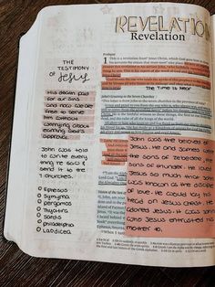 an open bible with the words revealed in it and some writing on top of it