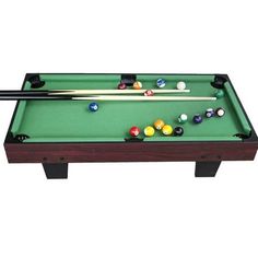 the pool table is made from wood and has two cues, one billiarder's stick and three balls on it