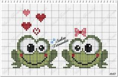 two green frogs cross stitched together with hearts on their heads and the words love is in