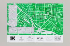 a green and white city map is shown