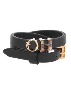 Editor's Note Built On The Reimagining Of The House Monogram, The O.H Monogram Black Wrap Leather Bracelet With A Signature Vegan Leather Double Strap Has Been Designed And Constructed At The Atelier. Enameled Alphabets Of ‘Oh’ In 22K Gold Plating Add An Irresistible Charm And Unmistakably Contemporary Beat. Material: Brass Plating: 22K Gold Plating Care: Store your jewelry in a box away from humidity or extreme surroundings. Use a dry cloth to clean it. About the Designer Outhouse With their un Bracelet Indian, H Monogram, Personal Shopping Service, Charms Necklace, Indian Fashion Designers, Pernia Pop Up Shop, 22k Gold, Baroque Pearls, Personal Shopping