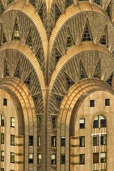 an art deco building with arches and windows