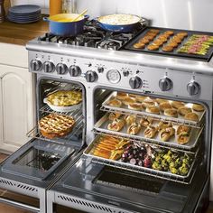 two ovens with food cooking inside of them in a kitchen next to a counter