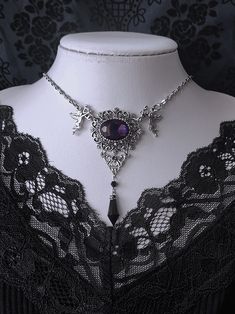 Elevate your gothic ensemble with our exquisite necklace. This stunning piece features intricate floral carvings and a mesmerizing purple gemstone, exuding an air of mystery and elegance. The rhinestone pendant adds a touch of glamour, making it a versatile accessory for both casual and formal occasions. Embrace the allure of Gothic fashion with this unique and timeless necklace, perfect for adding a touch of vintage charm to your wardrobe.  Please note that this product includes only the necklace. Garment Size SizeFree SizeFull Length37+5 Fantasy Style Amethyst Purple Jewelry, Fantasy Style Purple Amethyst Jewelry, Purple Amethyst Fantasy Jewelry, Gothic Pendant Necklace For Party, Gothic Purple Metal Jewelry, Vintage Purple Choker Necklace, Gothic Jeweled Necklaces For Parties, Gothic Jewel Necklaces For Party, Gothic Necklaces With Jewels For Party