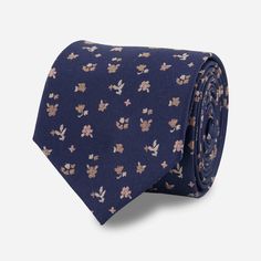 Allow us to introduce our Falling Florals Tie, a charming men's necktie that embodies sophistication and style with its bestselling navy blue color and geo-like floral pattern. | Men's Tie Bar: Falling Florals Tie - Modern, In Navy, Silk, Floral Dapper Business Ties For Summer, Classic Blue Suit And Tie Accessories For Summer, Business Neckwear With Ties For Summer, Blue Cotton Tie For Formal Occasions, Fitted Blue Floral Suit And Tie Accessories, Dapper Suit And Tie Accessories For Summer Business, Navy Formal Ties For Summer, Blue Dapper Suit And Tie Accessories For Summer, Dapper Blue Suit And Tie Accessories For Summer