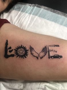 a person with a tattoo on their arm that says love and sun, eagle, compass