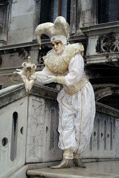 a statue of a man dressed in white