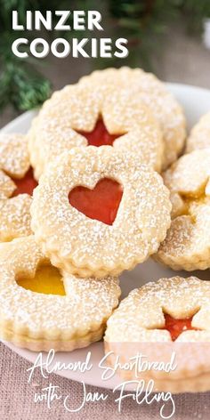 mini linzer cookies with jam filling on a plate