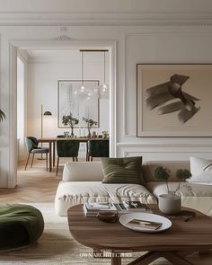 a living room filled with lots of furniture next to a dining room table and chairs