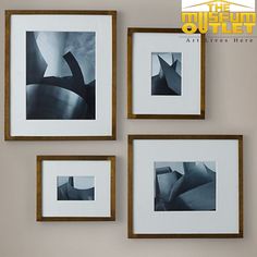 three framed photographs hanging on the wall