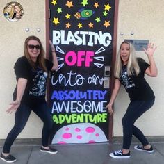 two women standing in front of a sign that says blast off unto an absolutely awesome adventure