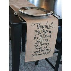 a table that has a plate on it and a napkin with the words thank you for the food