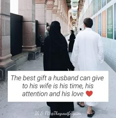 two people walking down the street with a sign that says, the best gift a husband can give to his wife is his time, his attention and his love