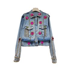 Expertly crafted with handmade rhinestones and rivets, this slim fit short denim jacket is the epitome of style and quality. Featuring a sleek and flattering fit, this jacket is perfect for adding a touch of glamour to any outfit. - Color: Purple, White, Multicolor- Style: Denim Jacket- Pattern Type: Solid- Sleeve Length: Long Sleeve- Fabric: Polyester- Closure Type: Buttons- Details: Rhinestones, Rivet- Occasion: Casual- Gender: Women- Size: M, L (Unit: cm)M：Length：49 | Shoulder：39 | Bust：104 |