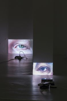 an art installation with multiple images projected on the wall