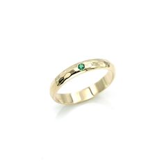 This Emerald ring band is a perfect wedding band. Emerald is known as the stone of successful love and it promotes loyalty between partners. This beautiful green gem has been used for centuries as a symbol for love. ITEM DETAILS • Band Measurements: 3mm wide x 1.5mm thick • Gemstone size: 1.75mm • Hammer textured with a high shine polished finish Timeless Emerald Ring With Bezel Setting For Anniversary, Timeless Thick Band Promise Jewelry, Fine Jewelry Thick Band Ring With Diamond Cut, Timeless Sapphire Promise Ring With Round Band, Timeless Sapphire Promise Ring, Thick Band Diamond Cut Ring For Promise, Timeless Emerald Ring With Bezel Setting For Wedding, Promise Rings Stackable With Round Band, Stackable Promise Rings With Round Band