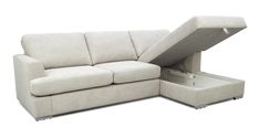 a white couch with a pull out bed underneath it