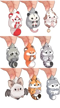 several different kinds of cartoon animals being held by someone's hand