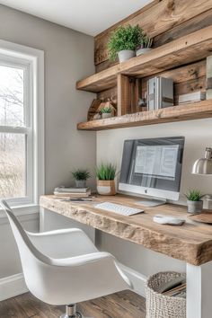 a desk with a computer on top of it in front of a window and bookshelves