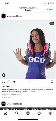 the woman is holding her hands up in front of her face and wearing a purple shirt