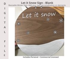 a wooden sign with snowflakes on it that says, let it snow - blank