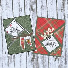 two cards with plaid designs on them sitting next to each other in front of a wooden background