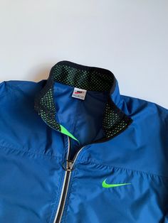 90's Nike Vintage Reflective Clima-fit Windbreacker Men's Jacket Size: L Excellent condition. No stains and holes Please check measurements: - armpit to armpit 66 cm (25,98 inch) - length 77 cm (30,31 inch) - sleeve length from throat 84 cm (33,07 inch) - armpit to cuff 62 cm (22,44 inch) All items are clean, washed. Shipping worldwide: I accept combined worldwide delivery with tracking numbers. Postage: We do the shipment within 2 days. Estimated shipping time: 10-28 working days (in rare cases Green Sporty Sport Coat, 90s Style Sports Track Jacket With Pockets, 90s Style Track Jacket With Pockets For Sports, 90s Style Green Track Jacket For Sports, 90s Green Sports Windbreaker, 90s Green Sports Outerwear, Vintage Green Windbreaker For Sports, Work Coat, Streetwear Hip Hop