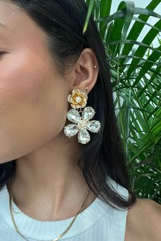 There’s nothing that says spring more than sparkles, florals and pearls. The Iris Rhinestone Flower earrings feature blossoming rhinestone flowers with pearl Irises. These earrings are the perfect compliment to any spring ensemble. **ALL ACCESSORIES ARE FINAL SALE** Crystal Flower Earrings For Party, Gold Crystal Flower Earrings, White Crystal Flower Earrings For Party, Elegant Flower-shaped Earrings With Rhinestones, Elegant Flower Shaped Rhinestone Earrings, Elegant Flower-shaped Rhinestone Earrings, Glamorous Crystal Flower Earrings For Party, Gold Crystal Flower Earrings For Party, Sparkling Flower Earrings For Party