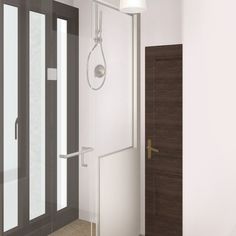 a bathroom with a shower head and glass doors