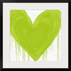 a green heart with dripping paint in the middle and black frame on white paper behind it