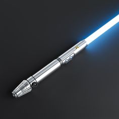 a star wars light saber is shown on a black surface with blue lights coming from it