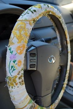 a steering wheel cover with flowers on it