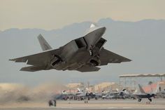 a fighter jet taking off from an airport runway