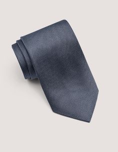 This grey self-pattern tie offers a classic look with a touch of magnetic charm. This versatile silk tie allows more interesting outfit combinations. The self-pattern on this tie adds a subtle layer of visual interest to your outfit, making it an attractive men's accessory. It can elevate a simple shirt and suit combination without being overly loud. This self tie is an adaptable option that can be dressed up or down depending on the occasion and your outfit pattern. 100% silk 100% polyester lin Dapper Ties For Office, Gray Ties For Business, Gray Business Ties, Modern Suit And Tie Accessories For Business, Gray Standard Tie For Business, Black Suit And Tie Accessories For Business Casual, Elegant Edgy, Suit Combinations, Interesting Outfits