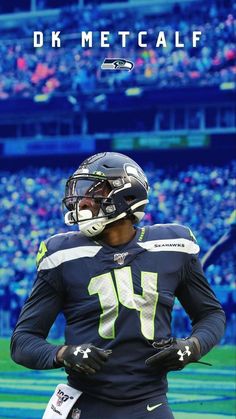 a football player is standing on the field with his hands in his pockets and wearing a helmet