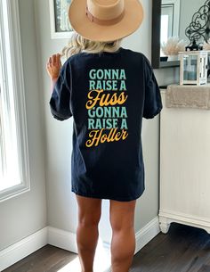 Gonna Raise A Fuss Shirt - 90s Country Shirt, Alan Jackson Shirt, Alan Jackson Tee, Western Graphic Tee, Summertime Blues, Concert Shirt ϟ High quality, direct-to-garment ink printed. ϟ ✦ Fit + Quality ✦ These UNISEX Comfort Colors tees are like a well-loved favorite - they wash well and are easy to wear. ✦ 100% ringspun cotton ✦ Preshrunk, soft-washed, garment-dyed fabric ✦ Twill taped shoulder-to-shoulder ✦ Set-in sleeves ✦ Double-needle stitched sleeves and bottom hem ✦ 1" ribbed collar with double-needle topstitched neckline Washing & Drying Instructions: ✦ Turn inside out. ✦ Wash with cold/warm water. ✦ Do not use bleach. ✦ Don't tumble dry - hang dry or lay flat to dry. ✦ Returns + Shipping ✦ My items are made to order - because of this, I am not accepting returns. If there are any d 90s Style Fan Merchandise Shirt For Summer, 90s Country Party, Distressed Band Tee, Country Concert Shirts, Summertime Blues, Boho Tshirts, Bride Tee, Country Girl Shirts, 90s Country