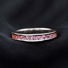 Product Details In this beautiful Half Eternity Ring Round Cut Created Pink Sapphire sets in Channel Setting. Gemstones are mounted in Solid Gold, a gorgeous ring for your lovely life partner to feel her special on Birthday. Product Information SKU SHP-RINGS0821182008 Width 3.5 mm Height 1.6 mm Weight 3.48 gm (Approximate) LAB CREATED PINK SAPPHIRE INFORMATION No.of Stones 12 Pieces Total Weight 1.80 Carat (Approximate) Dimension(approx) Round-3X3 mm-12 Pcs Color Pink Cut Brilliant Shape Round S Channel Setting, Life Partner, Pink Sapphire Ring, Eternity Band Ring, Half Eternity Ring, 18k Yellow Gold Ring, Signature Jewelry, Timeless Jewelry, List Style