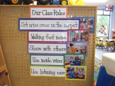 a bulletin board with pictures on it in a classroom setting, and the words our class rules written below