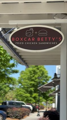 the sign for boxcar betty's fried chicken sandwiches