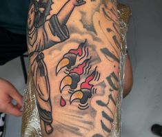 a man's arm with tattoos on it and an eagle in the middle of his arm